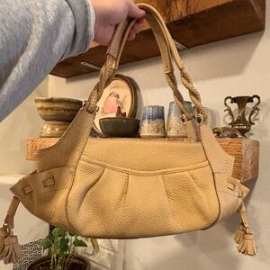 Cole Hahn camel color pebble leather bag w/tassels and braided leather straps